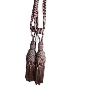 Set of 2 brown curtain tie tassels with copper beads detail approx 24” like new